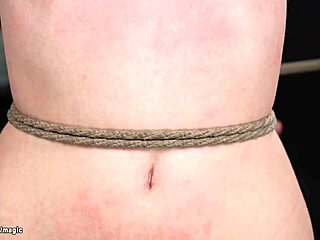 Extreme hogtied bondage with a tattooed BDSM slave