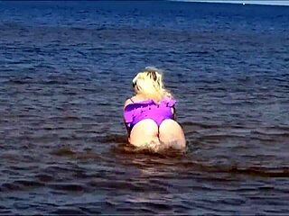 MILF with big ass in wet swimsuit