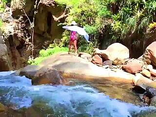 Lilyan indulges in solo play with a toy near a cliff