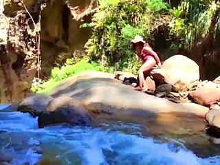 Lilyan indulges in solo play with a toy near a cliff