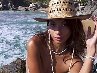 Carolina Reyes, a beautiful Mexican woman, undresses alone on the beach.