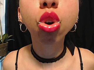 A young and pretty girl puts on hot pink lipstick and gets turned on