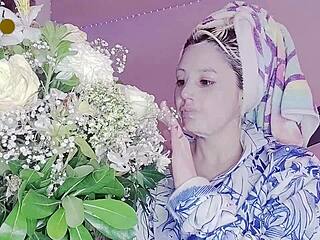 A young Russian woman wears a sexy mask after taking a shower