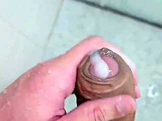 Beautiful young man enjoys a sensual bath with cum