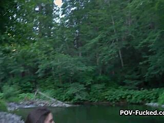 A beautiful woman with great big boobs makes love on the banks of a river