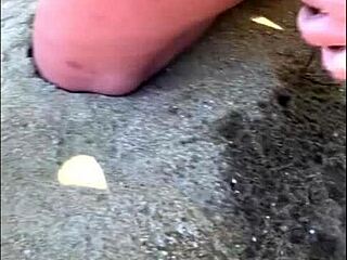 Amateur couple enjoys pee play on the beach
