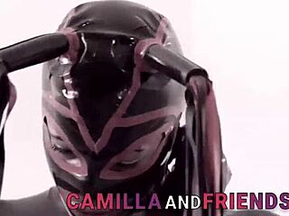Beautiful transsexual in latex outfit and mask enjoying pleasure