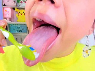 Purple Jordan has a webcam and shows her big lips and spits while brushing her teeth