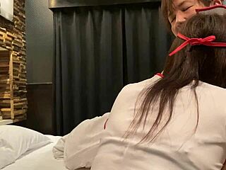 A goth nurse in a deepthroat blowjob scene with a naughty student in a hospital bed