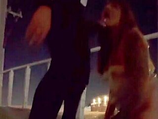 Lovebirds having sex on a bridge with a great view of the city