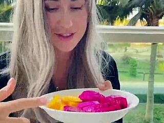 Beautiful model eats exotic fruits and looks as beautiful as she is