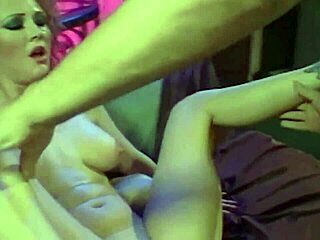 Double penetration action with a busty redhead stripper