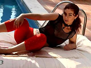 Julia Gomez, the hot milf in red hair, performs a sexy strip tease