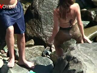 Horny teen rides her boyfriend on the beach publically