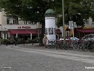 A blonde is gagged and tied up in a public place
