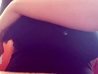 A young woman with a perfect body enjoys playing with her big natural breasts to achieve an orgasm
