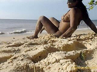 A young woman dances naked in the forest near a beach and gets some street attention
