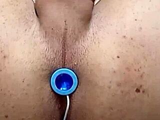 One gay hole filled with two toys and cum