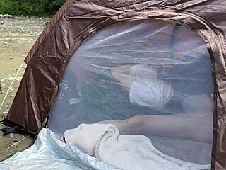 Beautiful college girl gives blow job in the woods during an outdoor camp and tries not to make noise
