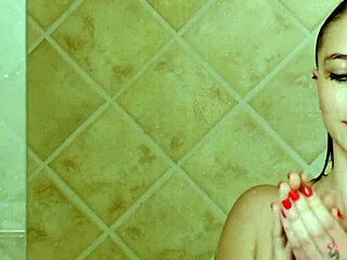 Beautiful brunette model washes up in the shower