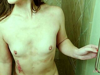 Beautiful brunette model washes up in the shower