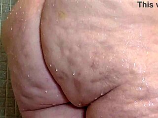 Steamy shower time with a big-boobed, fat MILF