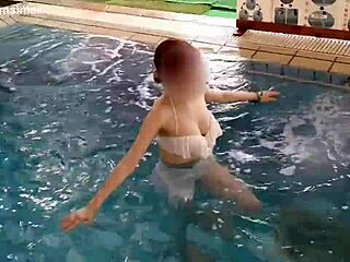 Beautiful Japanese girl swimming and exercising in the pool