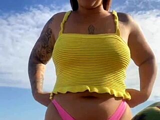 Wearing a bikini that exposes the big tits