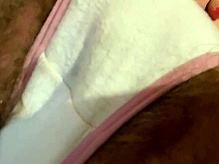 Amateur girl with hairy pussy masturbates through dirty panties