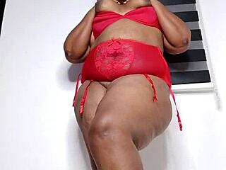 Curvy woman in sexy red underwear, teasing and playing
